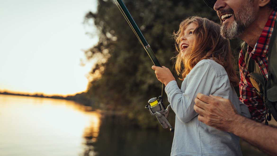 Man and girl fishing together