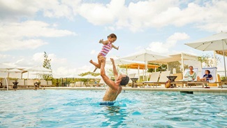 father and daughter at pool