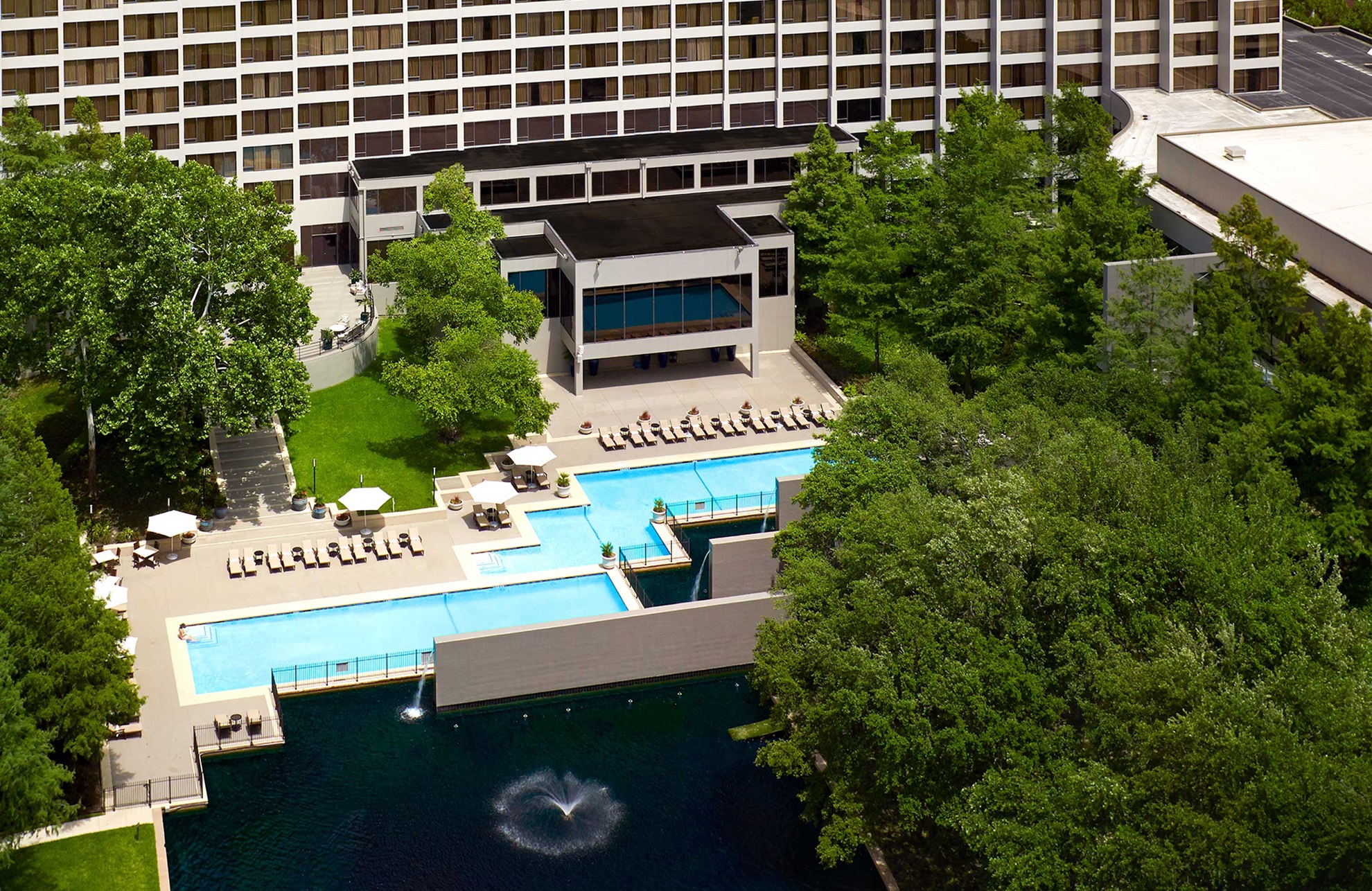 Aerial view of hotel and pool area.