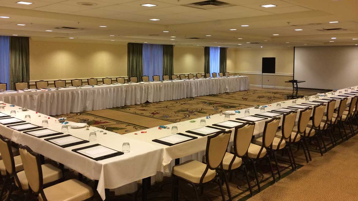 Large conference room with horseshoe set up