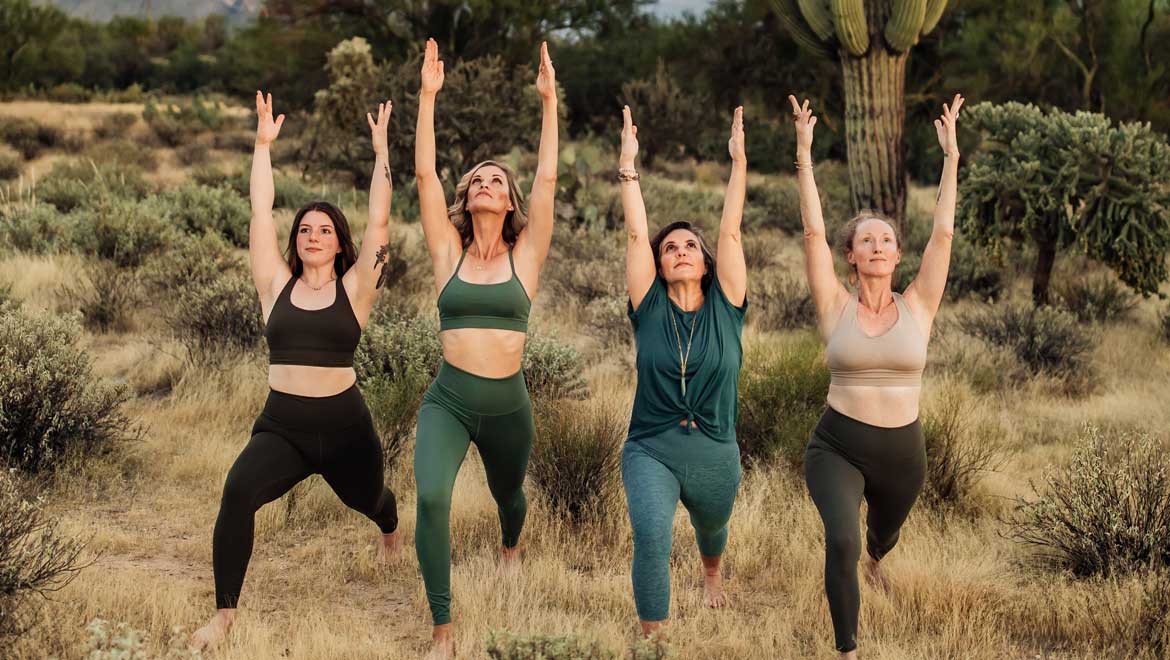 Ladies doing Yoga in the desert