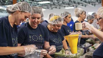 Omni employees volunteering making food 