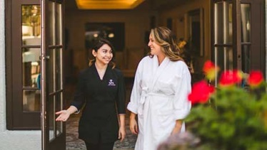 Omni employee and guest departing the spa