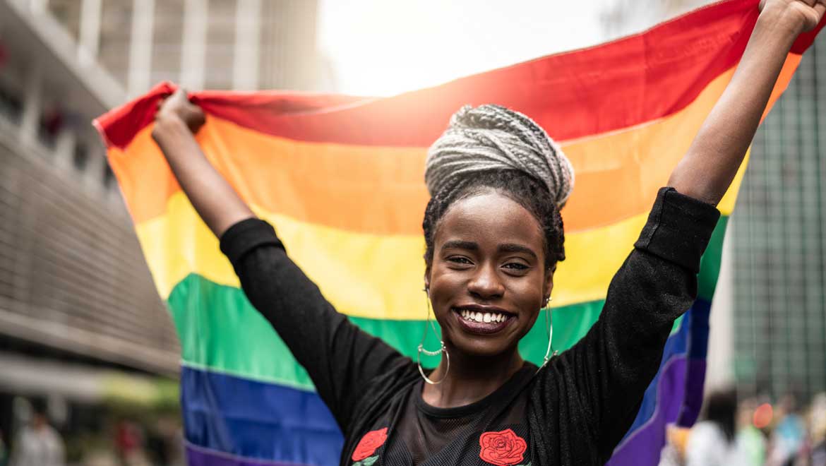 Lady holding a pride flag