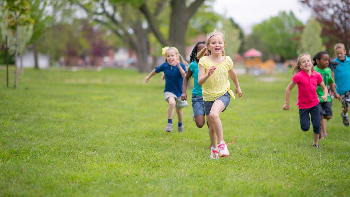 Kids running on the grass