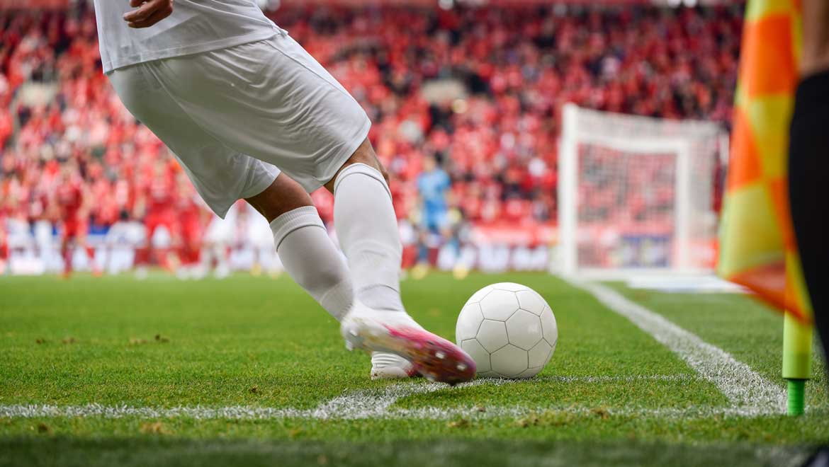 Man playing soccer.