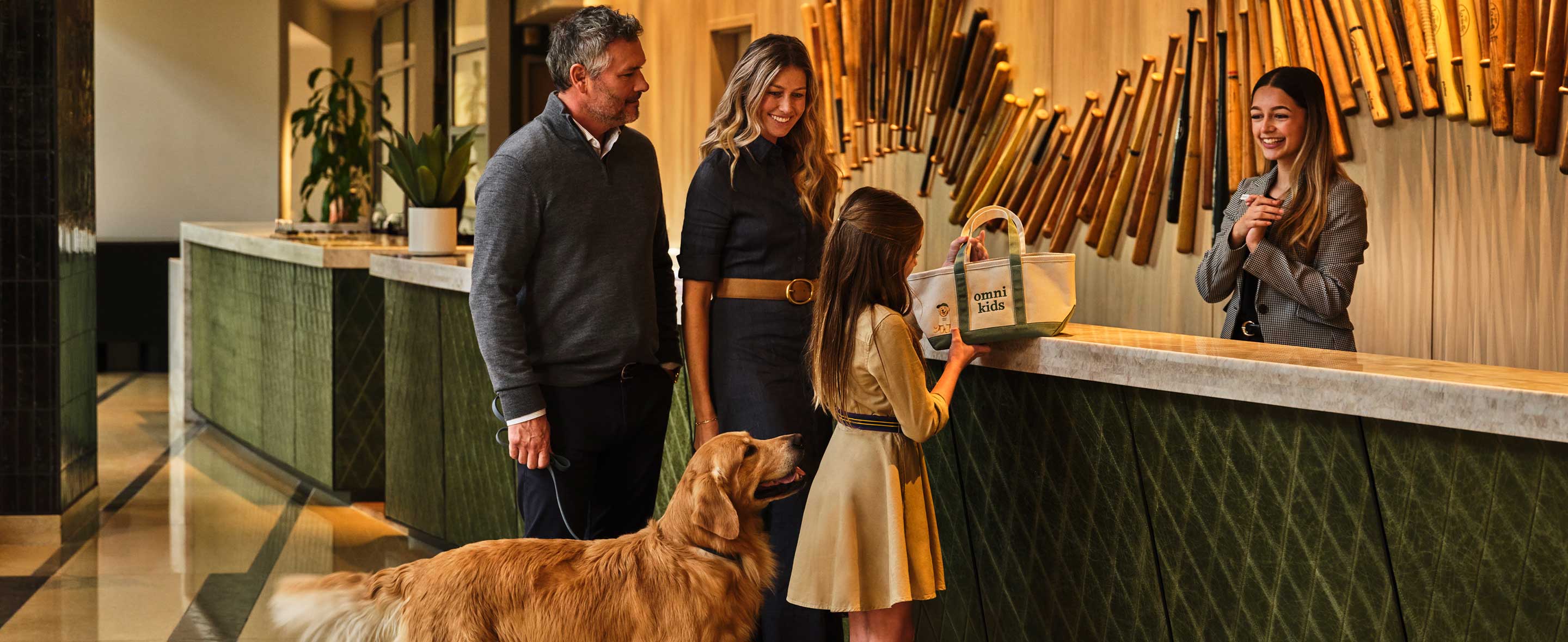 family checking into hotel