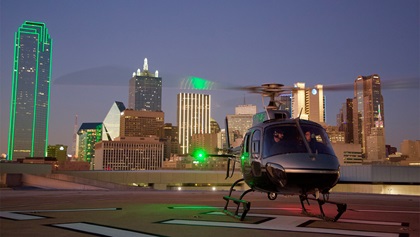 Couple in helicopter near Omni Dallas Hotel