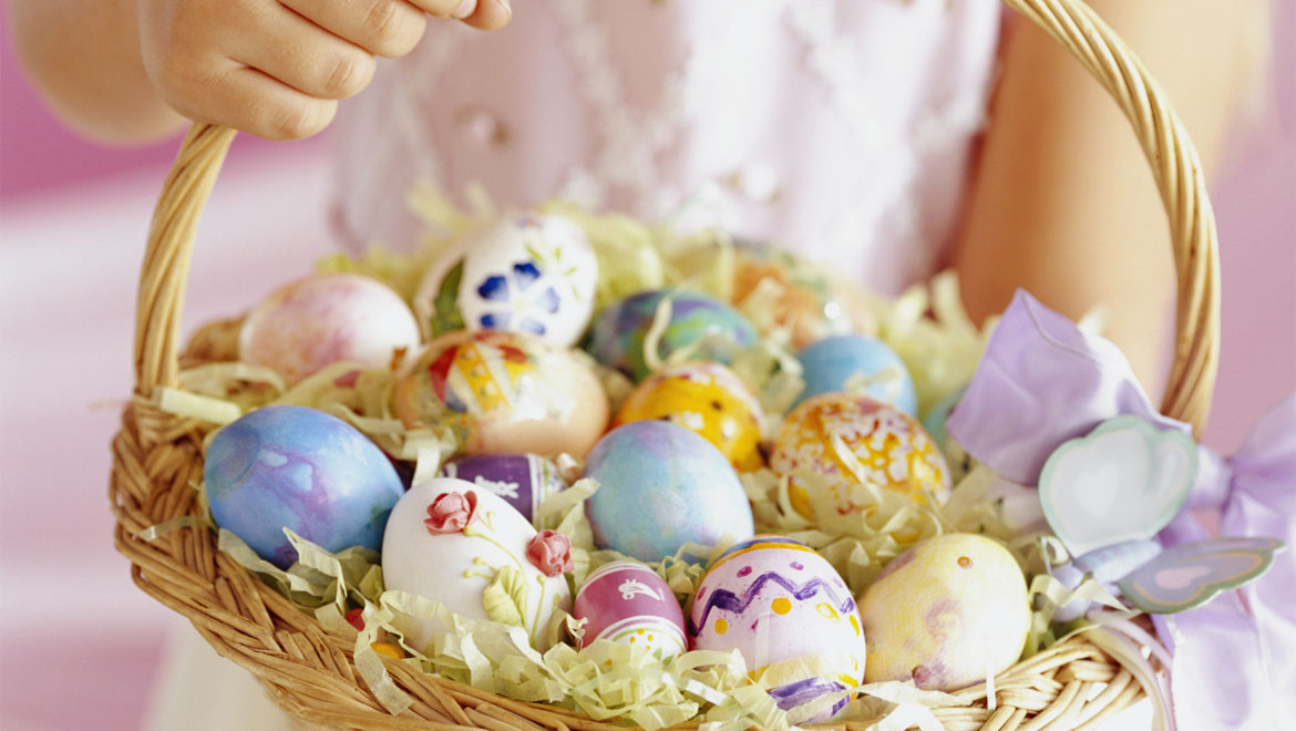 Basket with colorful easter eggs