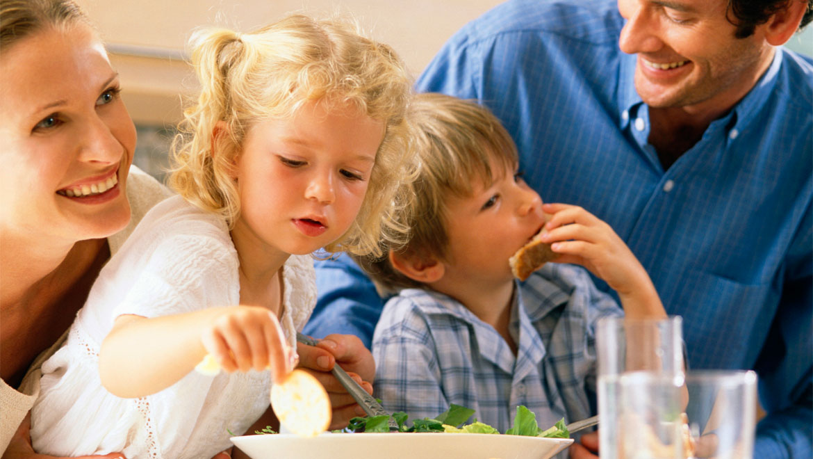 Kids eating with parents