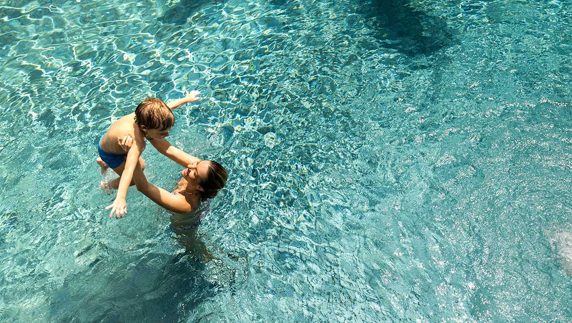 mom and son in pool