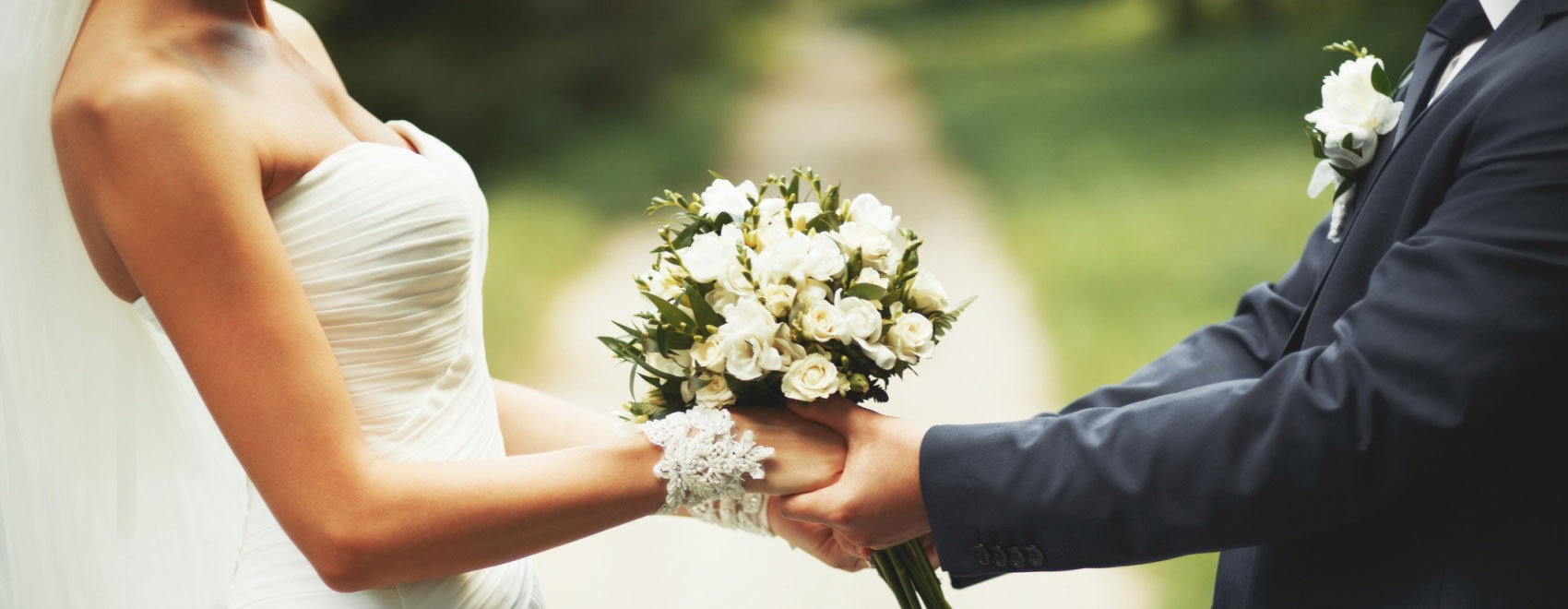 bride and groom holding hands