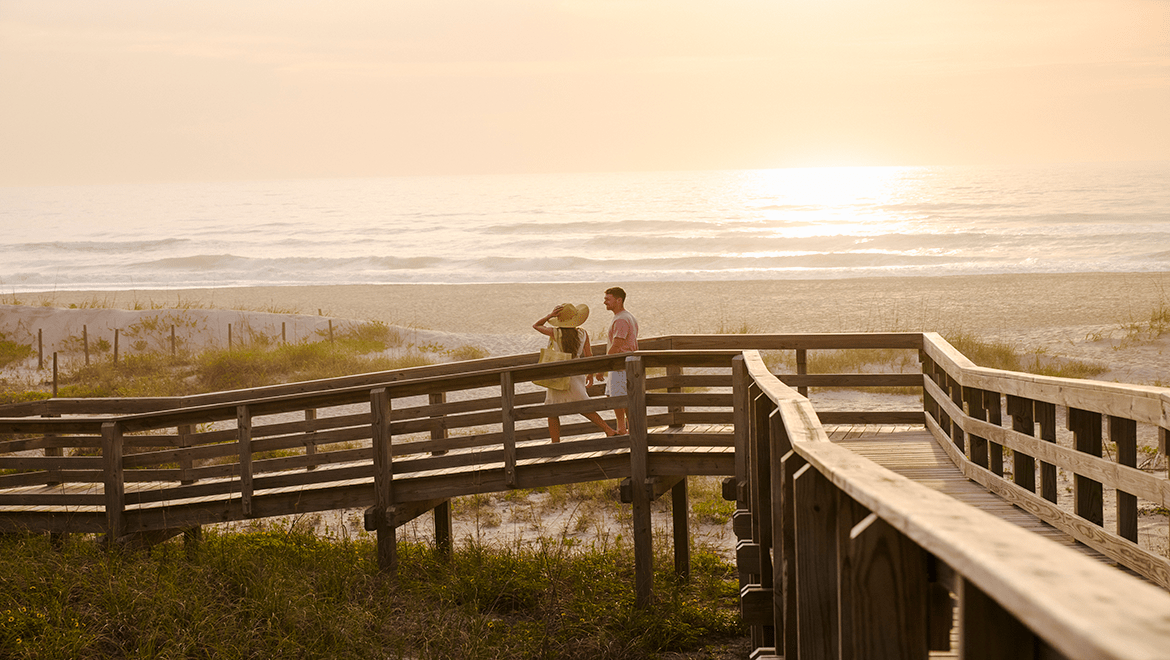 Couple Walking to the beach at  