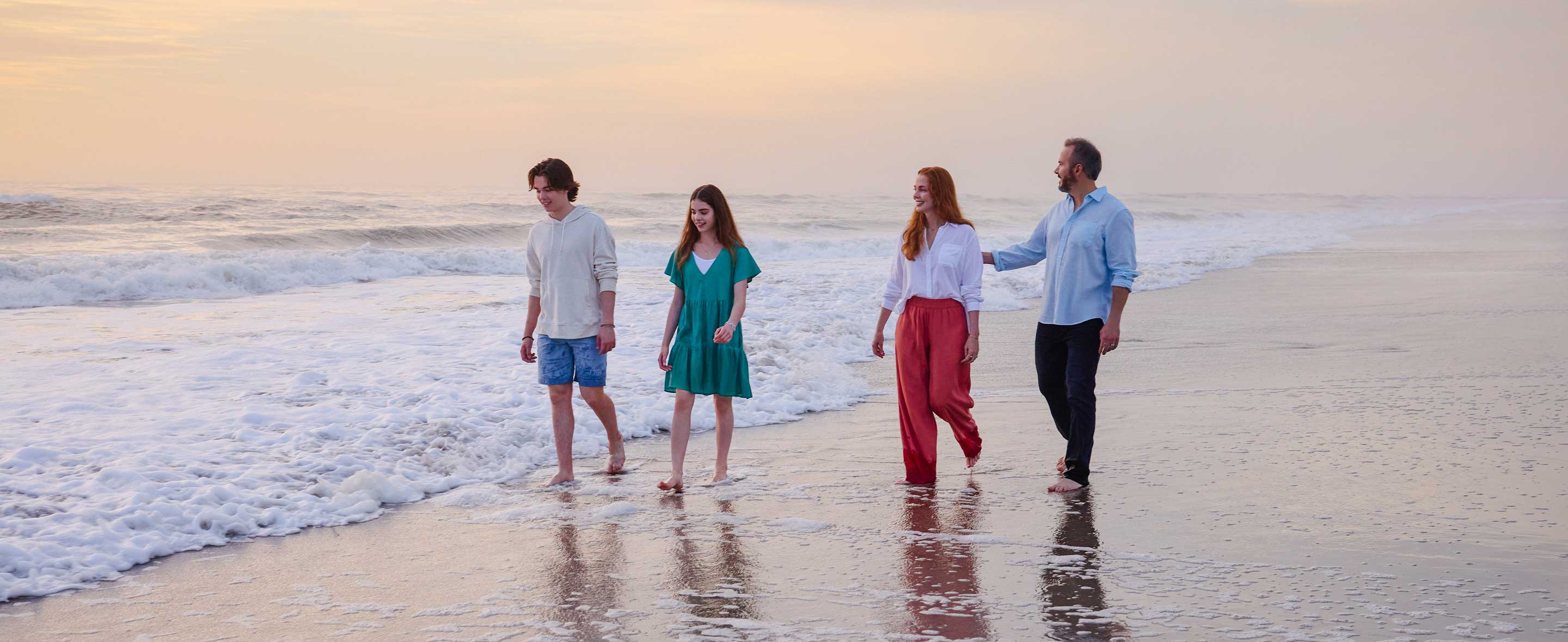Family walking on the beach