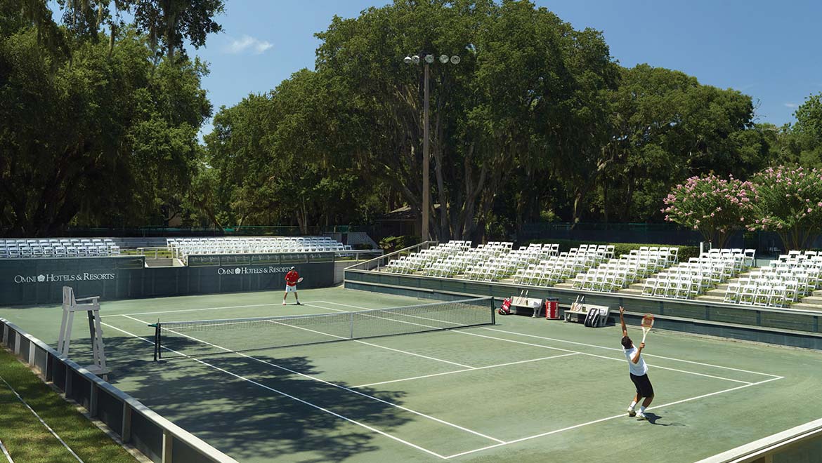 Tennis duo on a stadium court