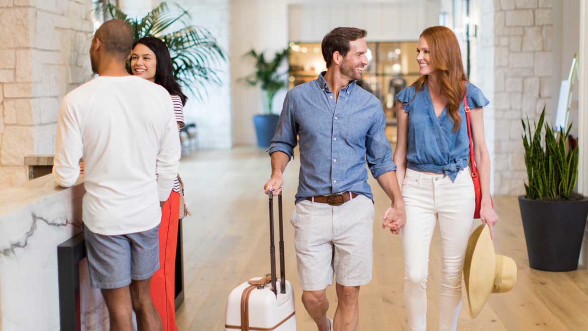 Couple checking into resort