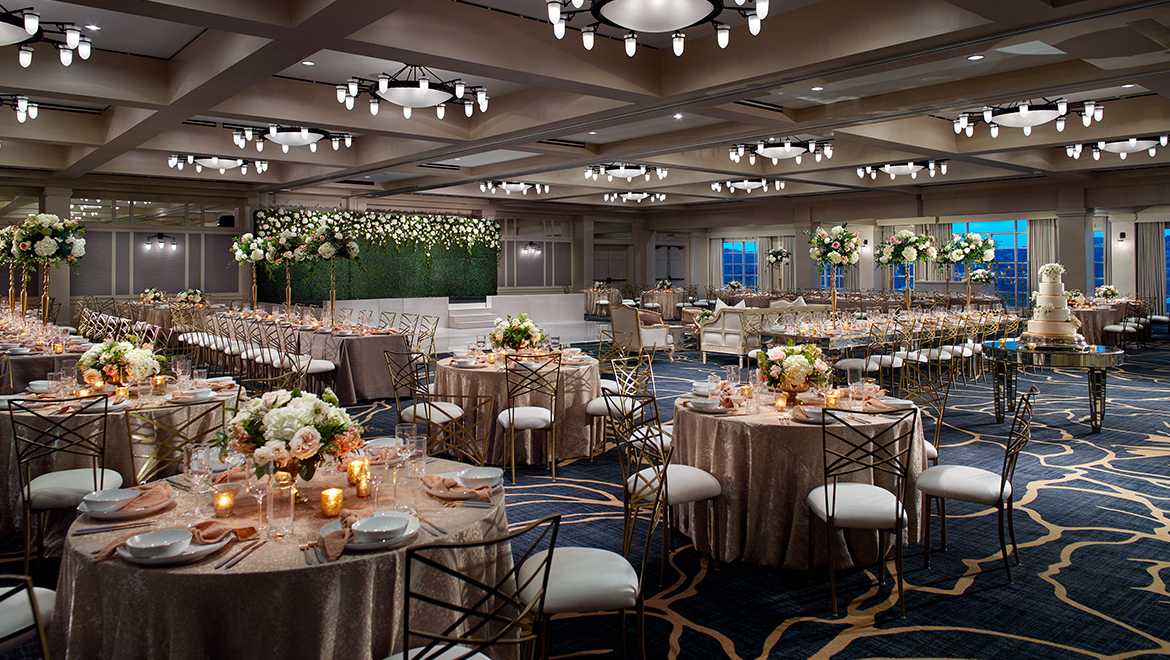 Wedding reception set up in ballroom.