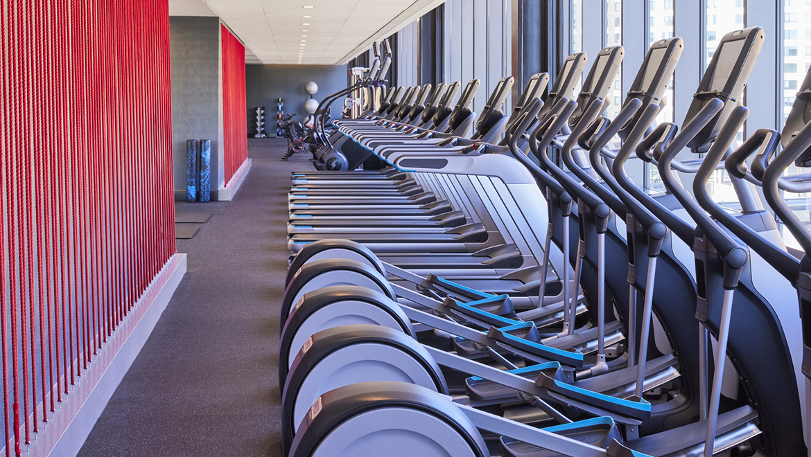 Keep up with your workout routine at the hotel fitness center, offering tons of natural light and  a variety of cardio machines - Omni Boston Hotel at the Seaport