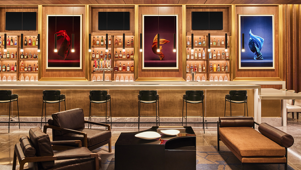 The bar at Kestra features three freeze-motion photographs of scarves in motion evocative of dance, by Neal Grundy - Omni Boston Hotel at the Seaport