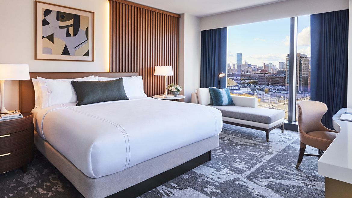 The Junior King Suites offer exquisite custom closets and spectacular skyline or bay views  - Omni Boston Hotel at the Seaport