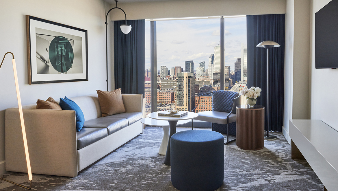 One Bedroom King Suites offer the comfort of separate living area with a color palette inspired by the sea - Omni Boston Hotel at the Seaport