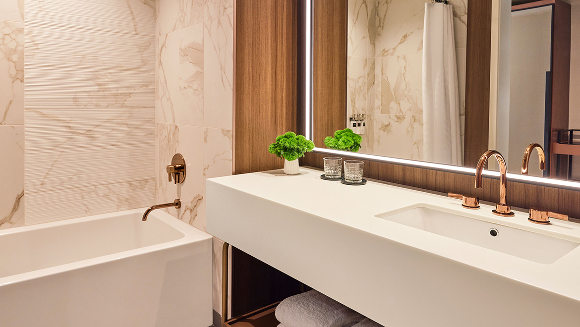 The Patron Tower bathrooms are spacious with rich wallcoverings and offer a bathtub option - Omni Boston Hotel at the Seaport