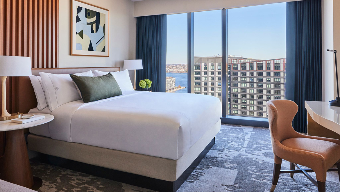 Floor to ceiling windows in the Patron Tower King guest rooms showcase stunning Seaport skyline or Massachusetts Bay views - Omni Boston Hotel at the Seaport