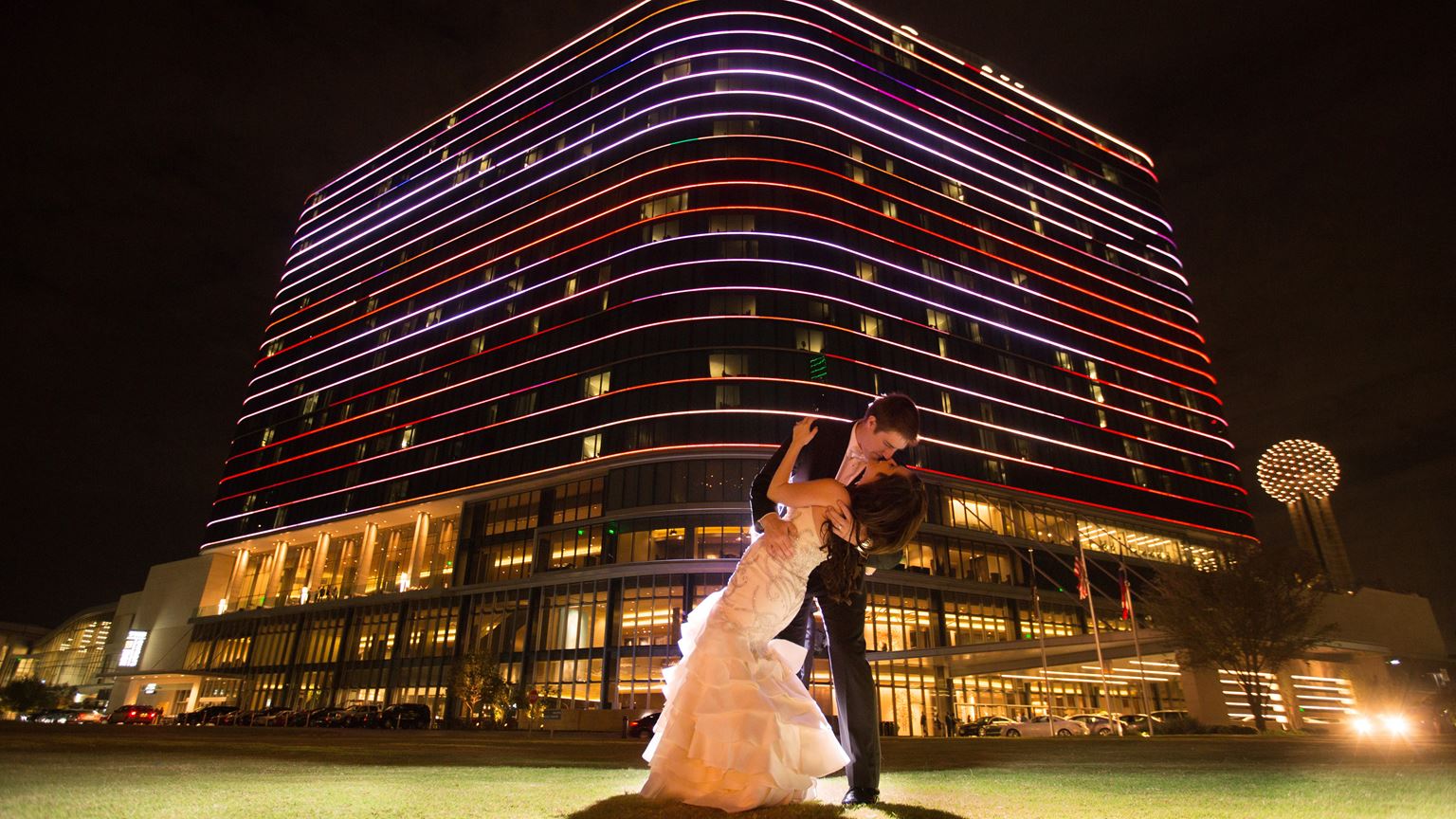 couple kiss on pegasus lawn 