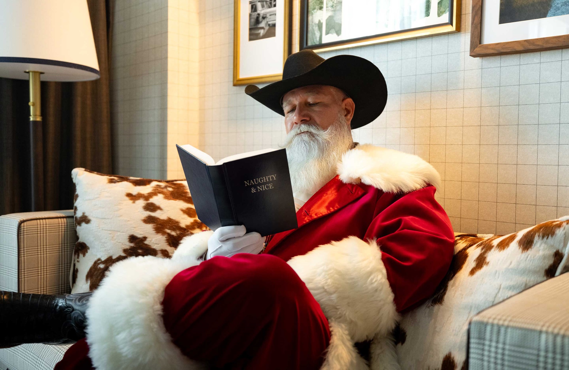 Santa reading Naughty & Nice book.