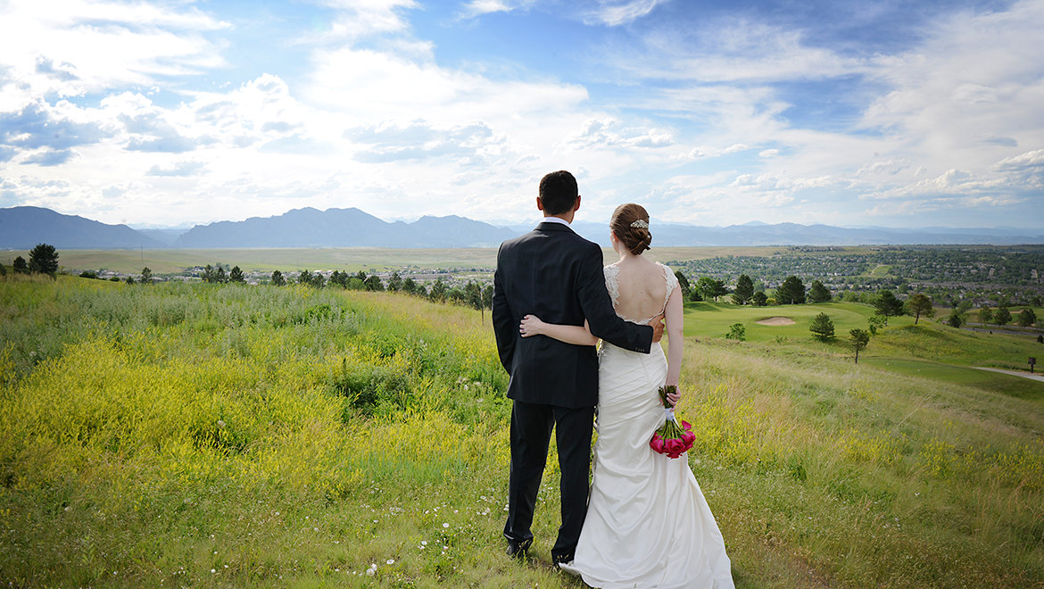 Omni Denver Interlocken wedding bride and groom in field