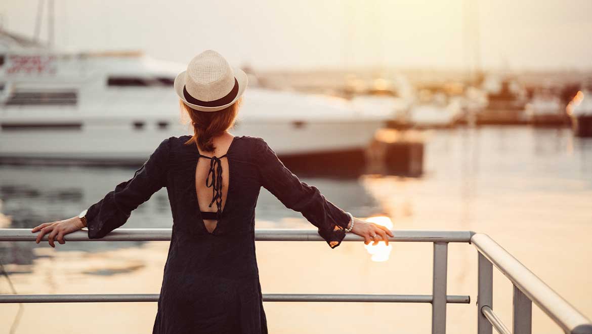 Woman looking at cruise ships