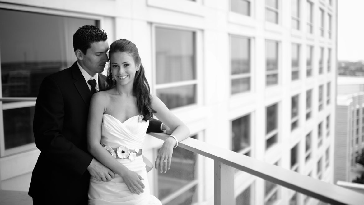 Bride and groom on the hotel balcony - Omni Fort Worth Hotel