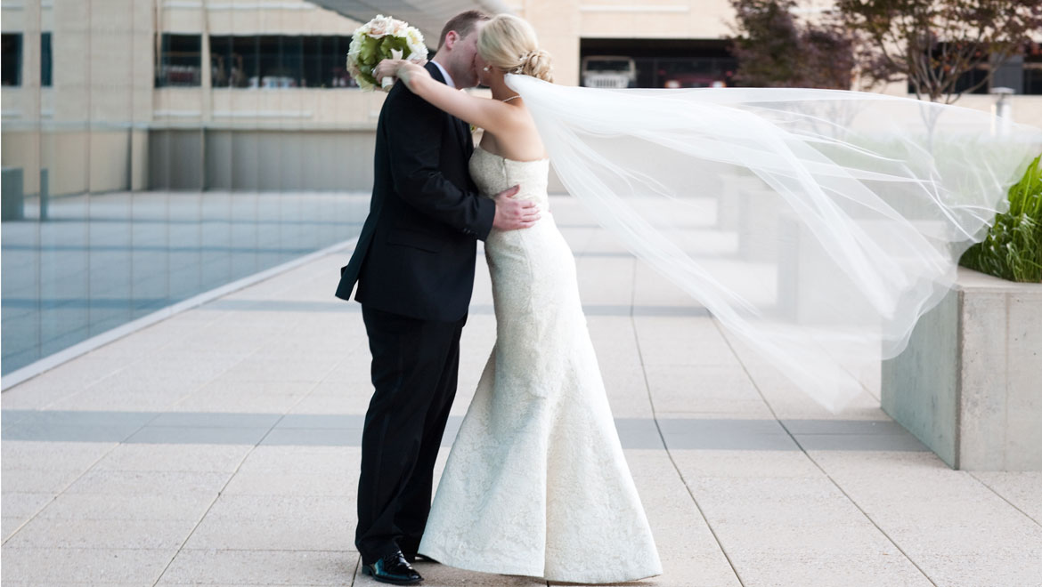 Bride and groom outside of Omni Fort Worth Hotel