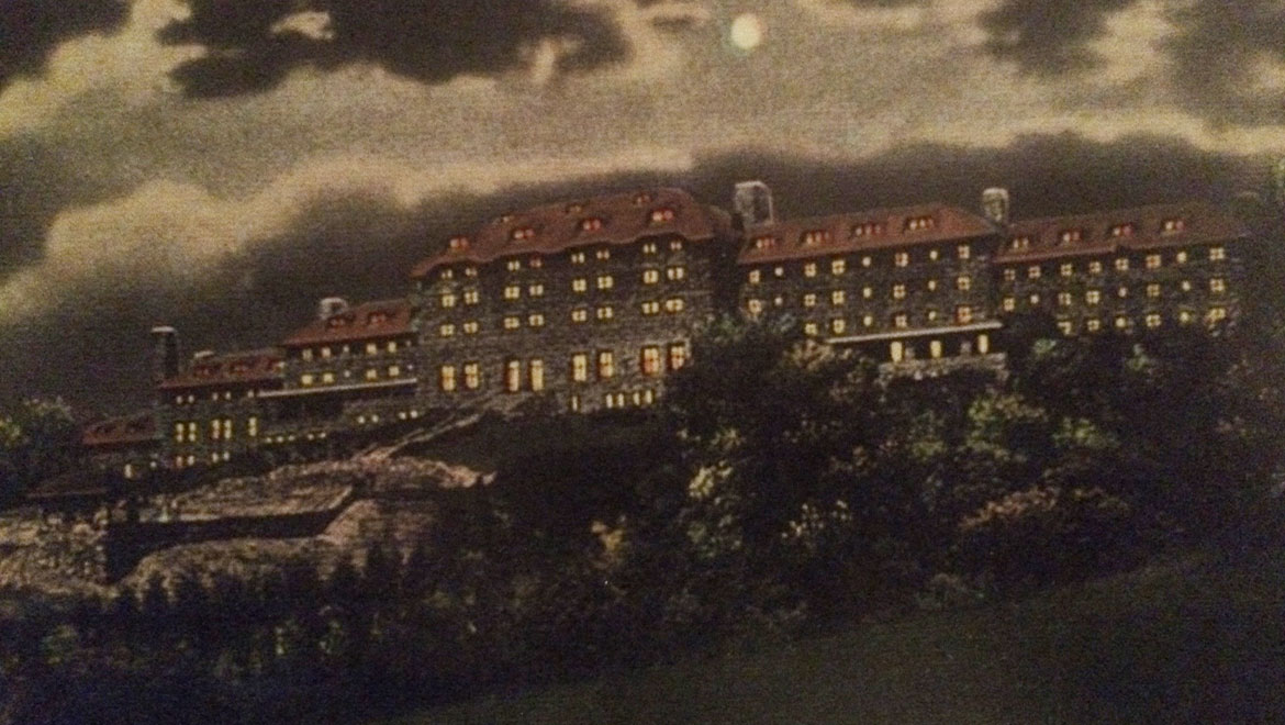 Reproduction of a 1916 postcard titled "Grove Park Inn by Moonlight"