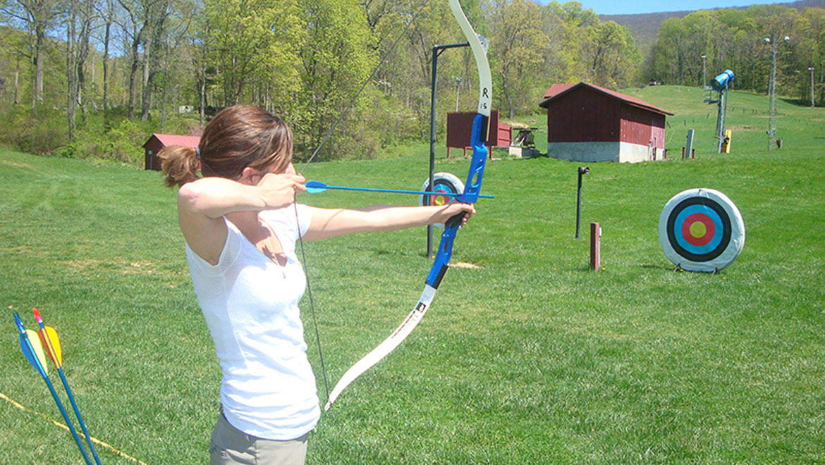 Practicing archery at the Homestead