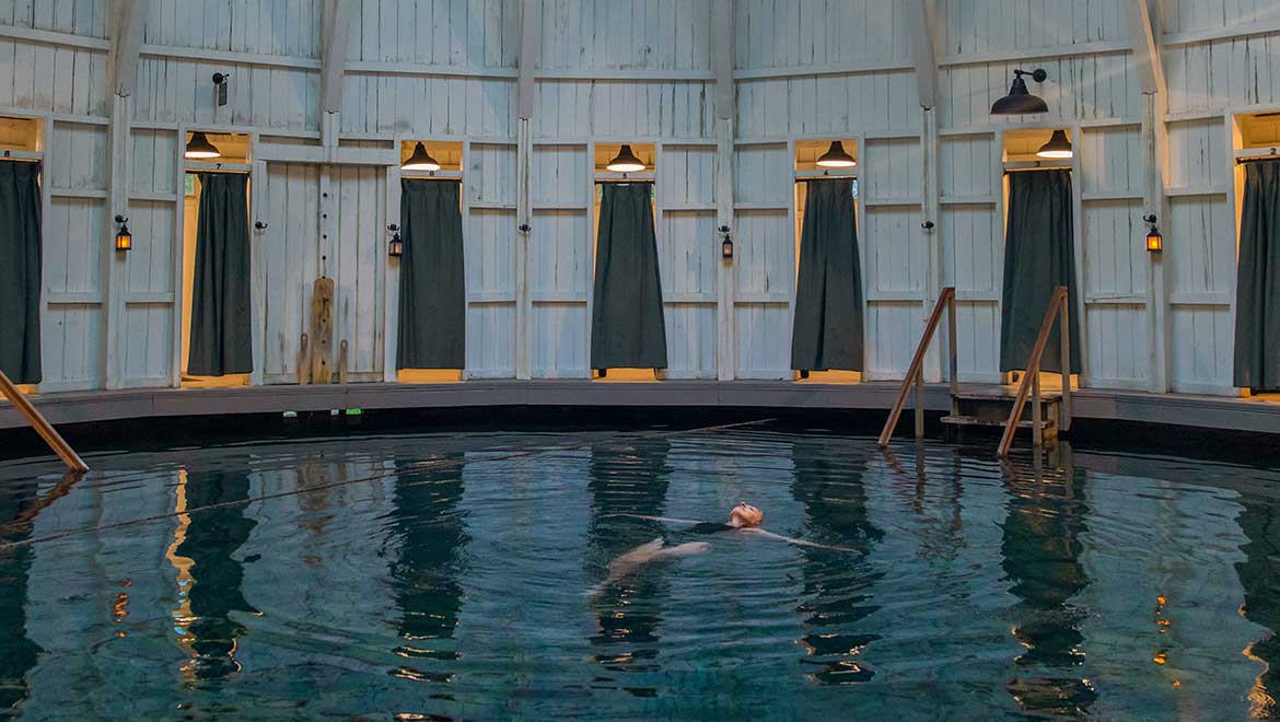 Woman floating in a pool