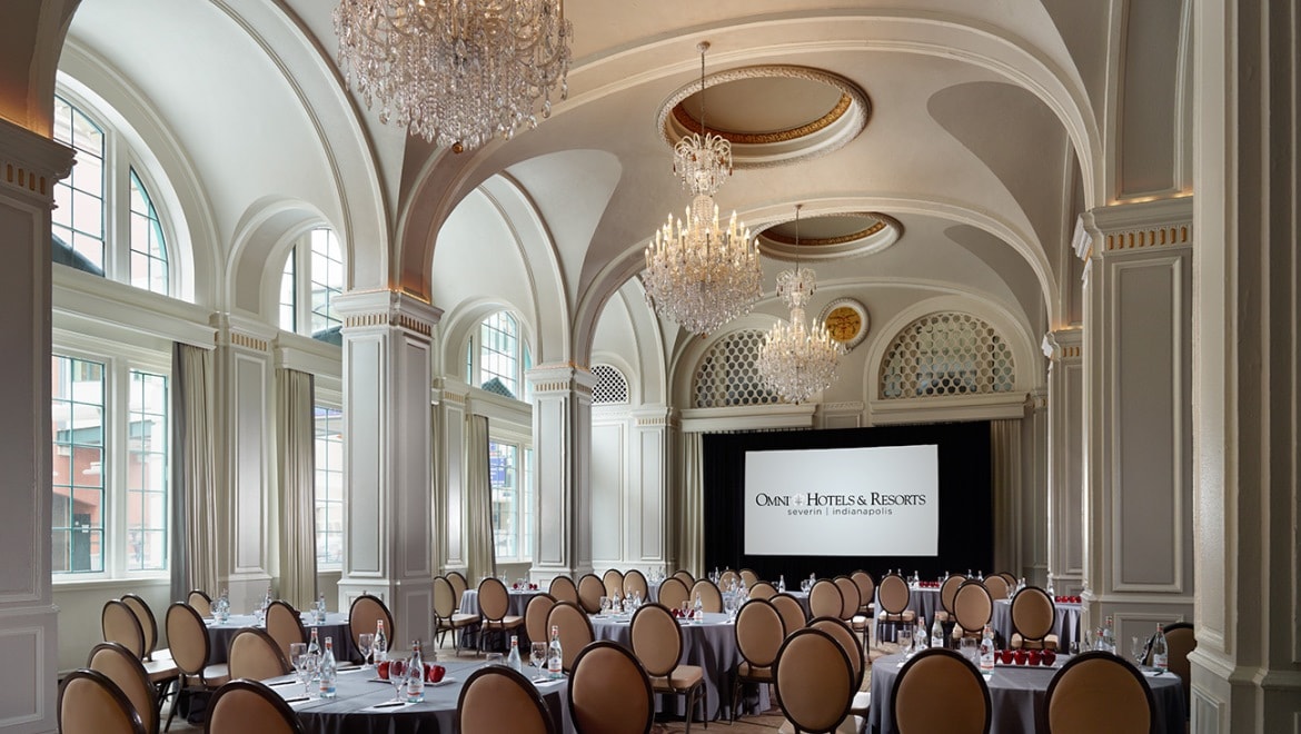 Large meeting room set up with banquet tables.