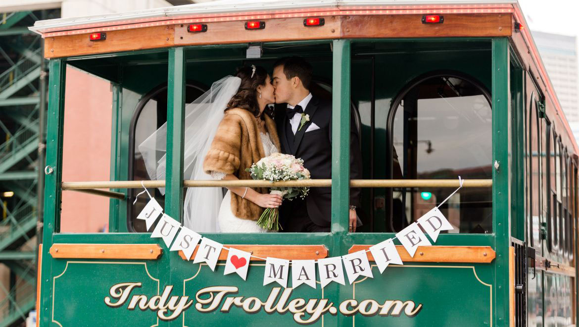 Bride and Groom Kissing in Trolley