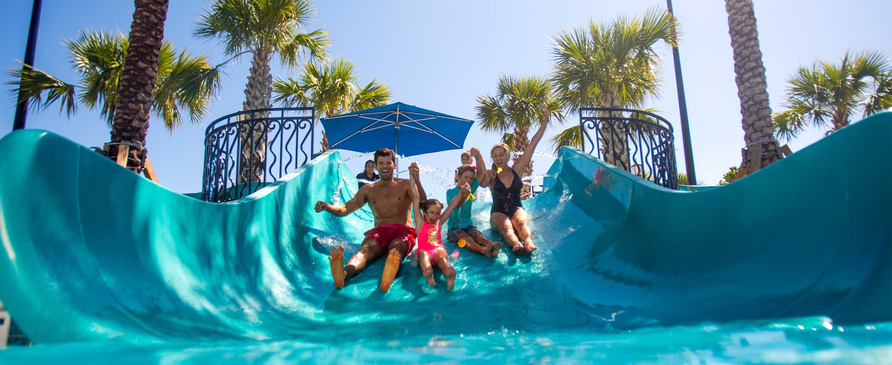 Family going down waterslide
