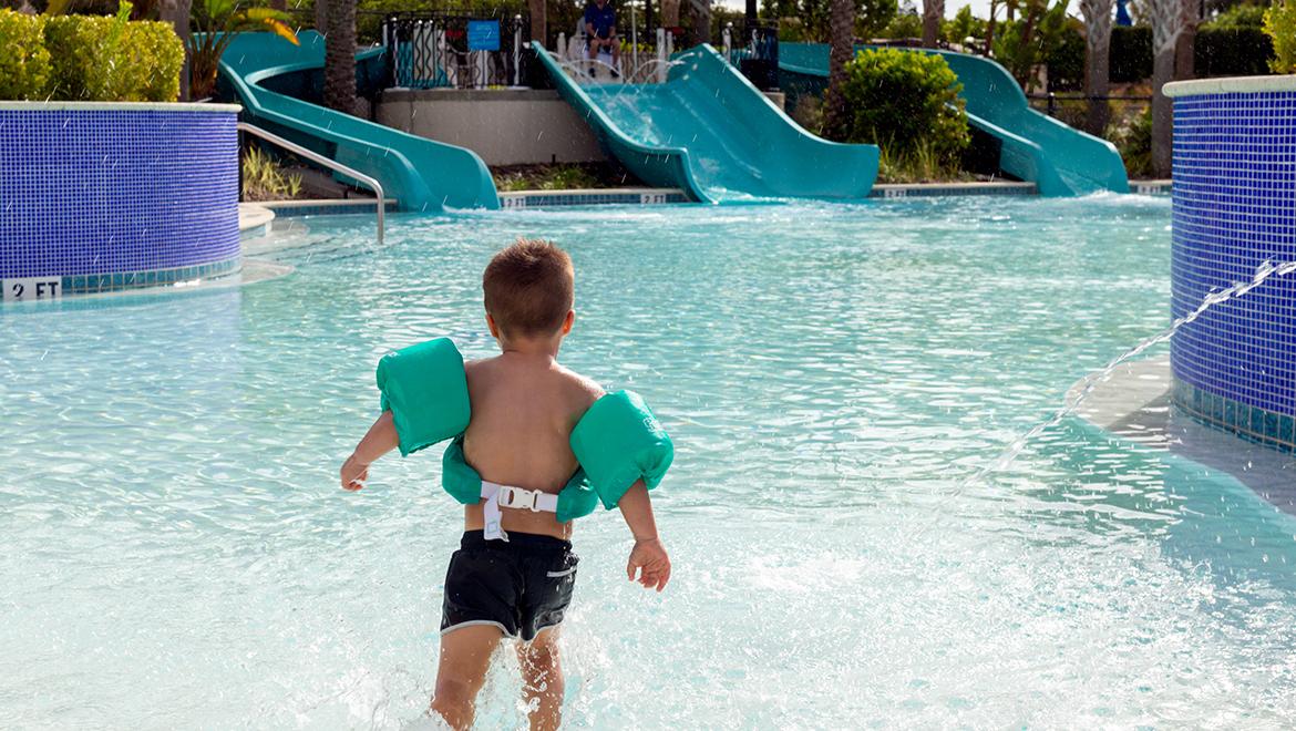 Boy playing in kids pool at Omni Orlando Resort