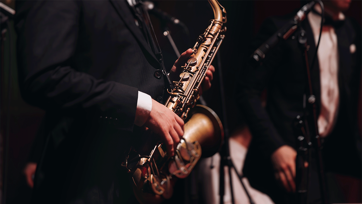 image of man holding a saxophone