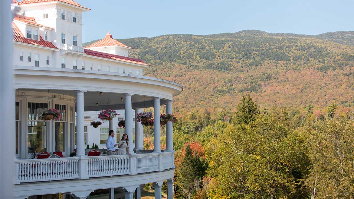 couple standing on porch
