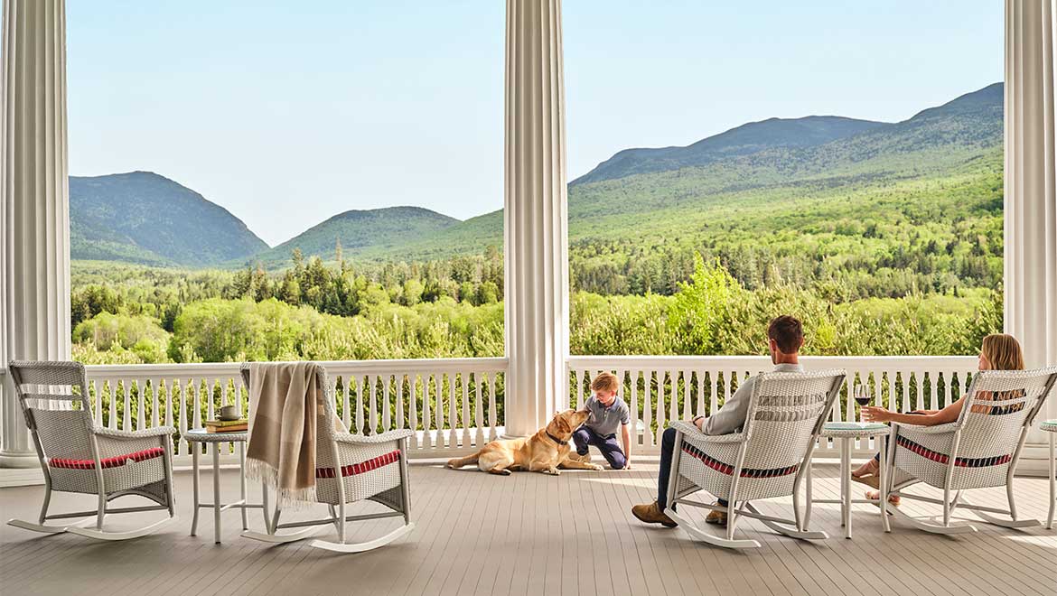 family sitting on porch