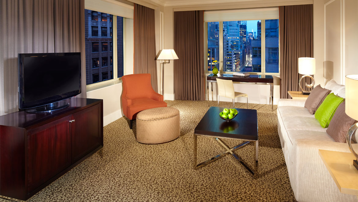 Madison suite living room and city view at Berkshire Place 