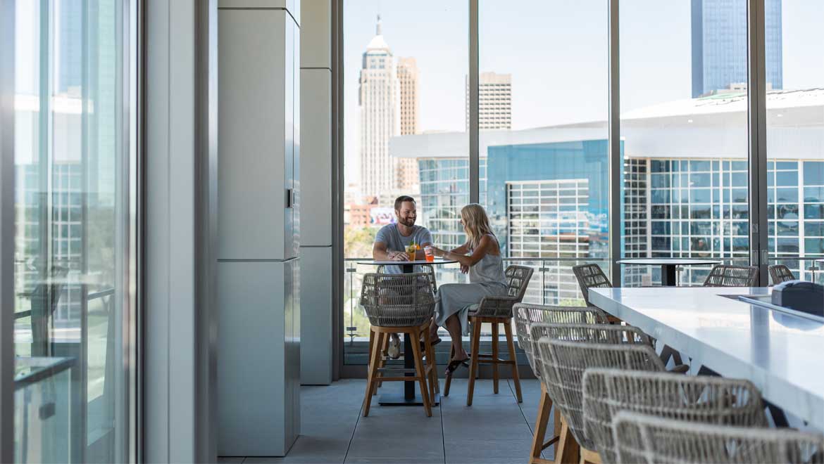Couple enjoying a drink at Catbird
