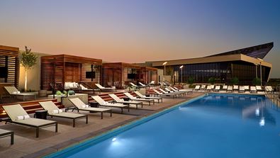 Lounge chairs by pool.