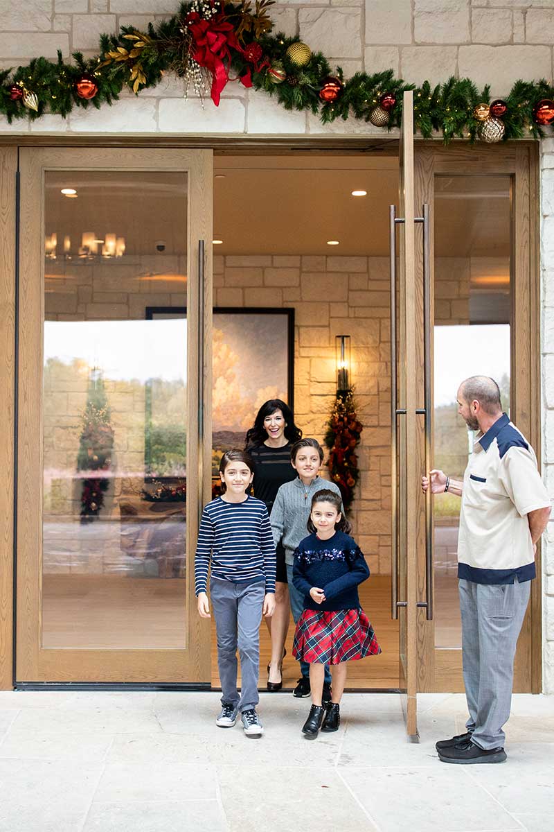Family walking through hotel entrance
