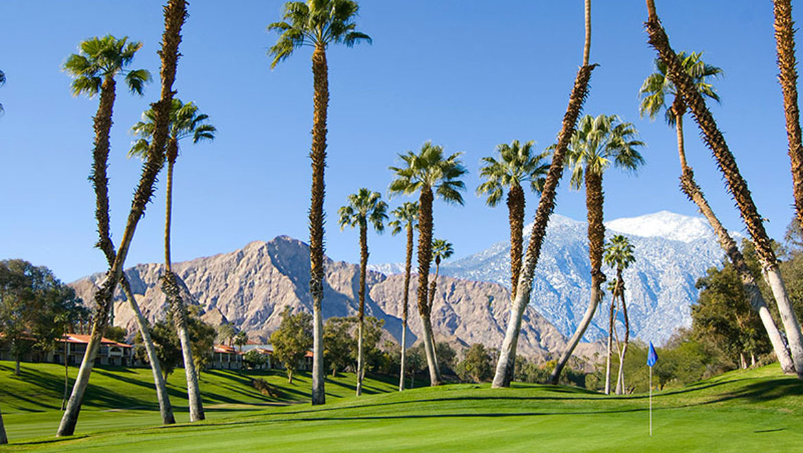 Omni Rancho golf course with mountains and palm trees 