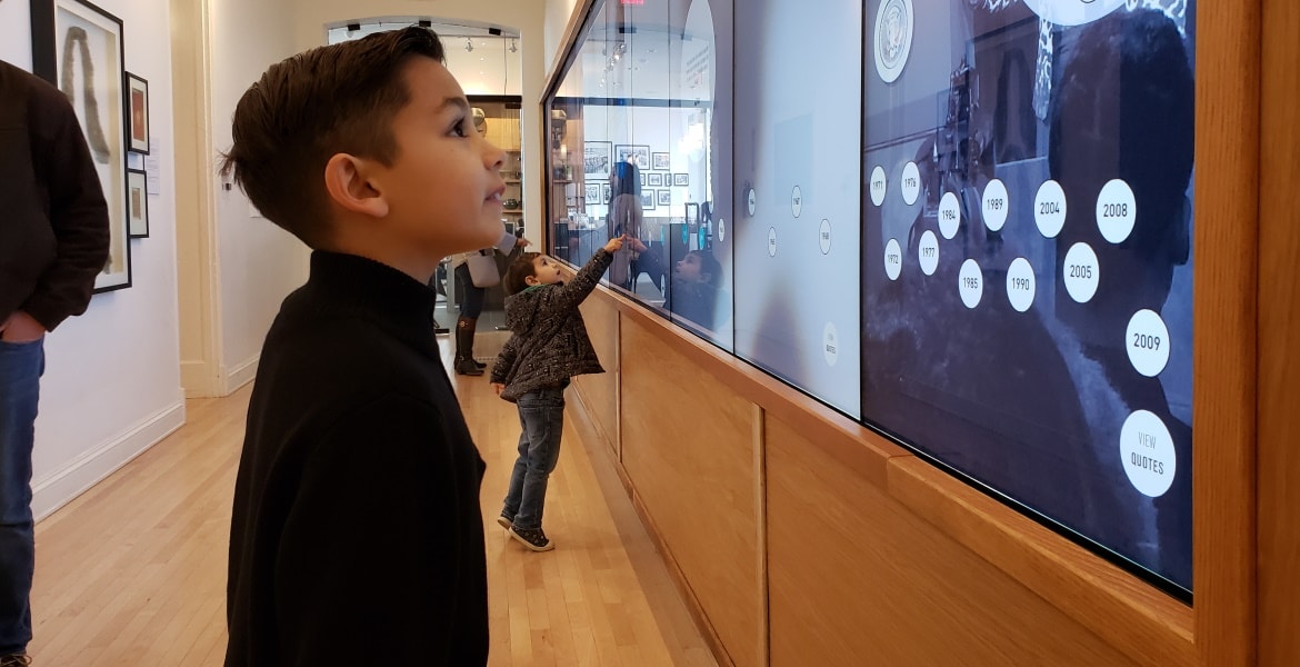Boy admiring art.