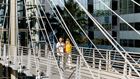 Couple walking across Skybridge